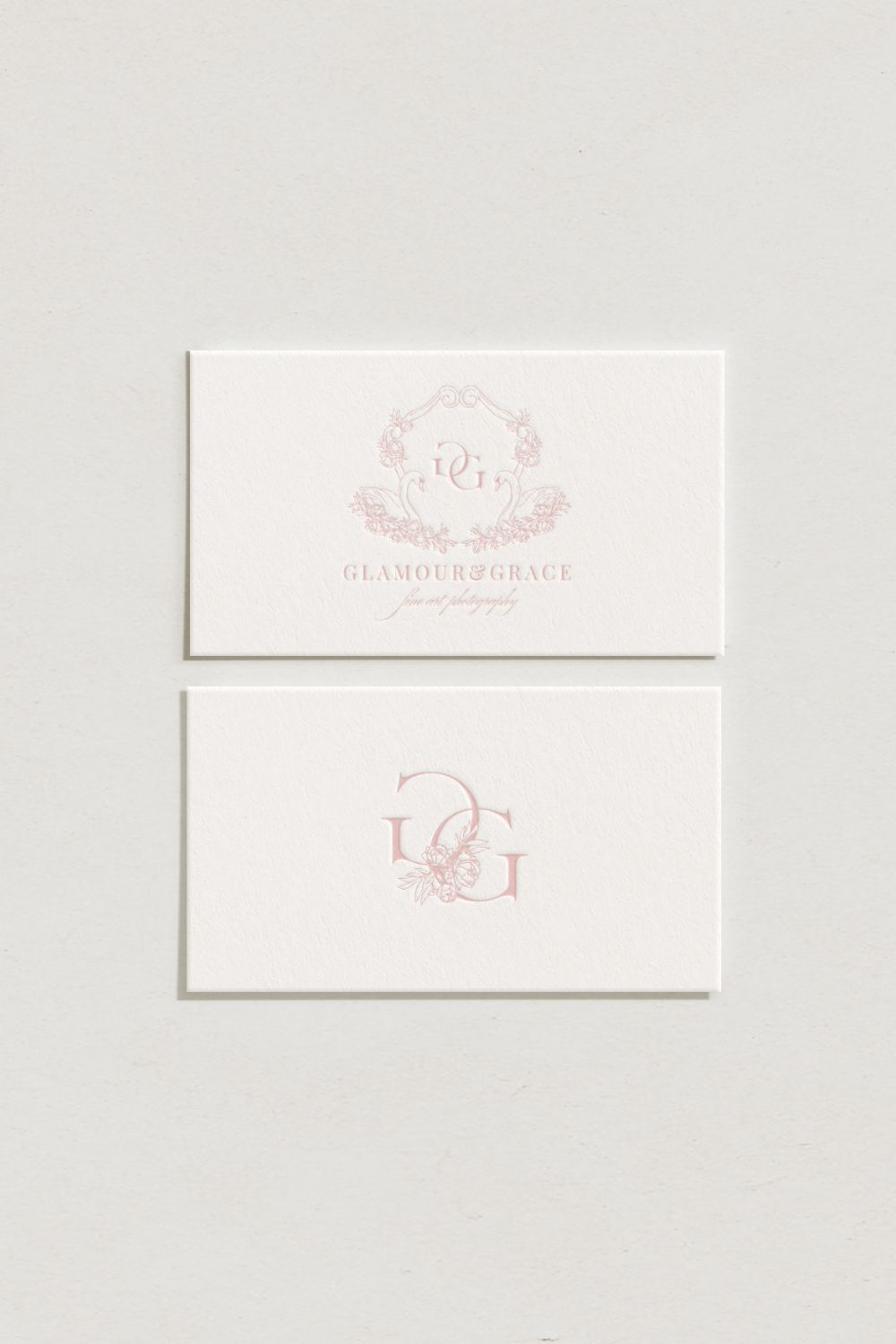 Elegant logo design for a fine art motherhood photographer, featuring romantic monogram branding, soft pink tones, and timeless details inspired by Bridgerton and classic portraiture.